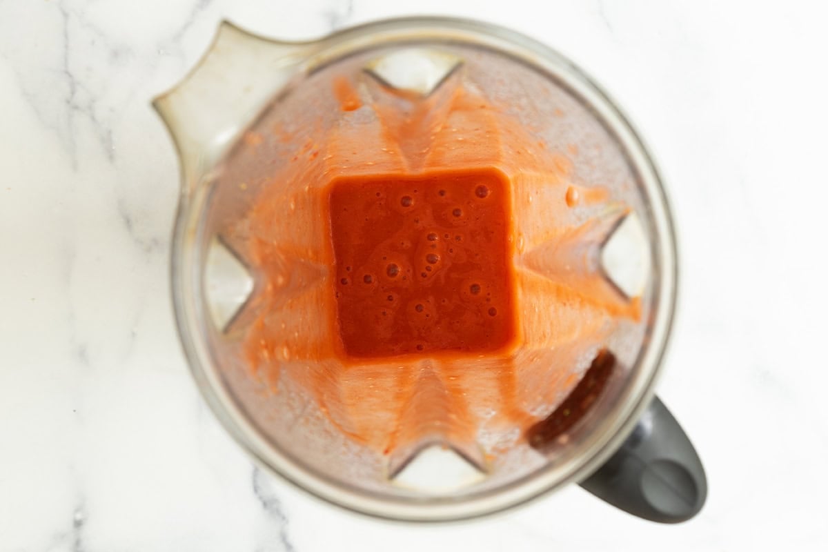 Blended strawberry and carrot puree in a blender.