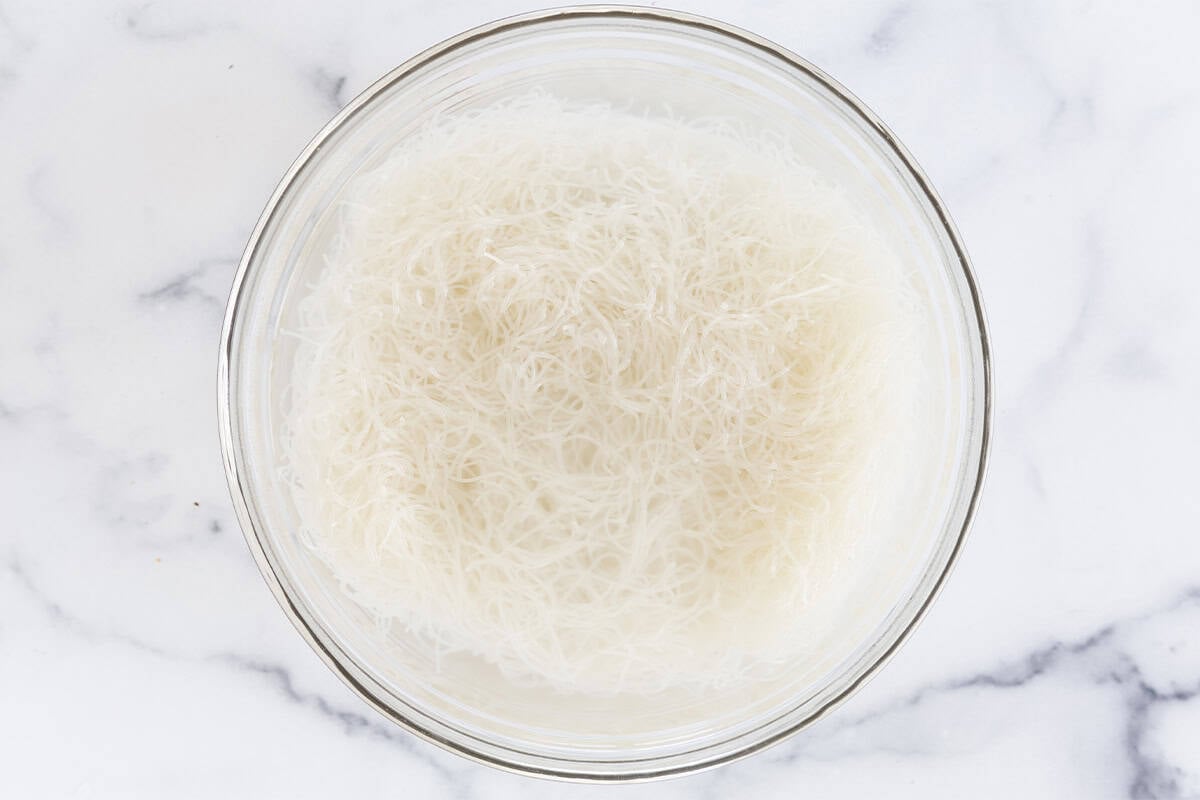 Cooked rice noodles in a bowl.