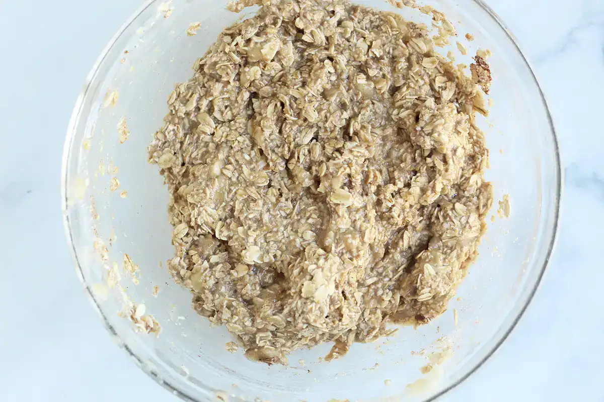 Banana cookie batter mixed in a glass bowl.