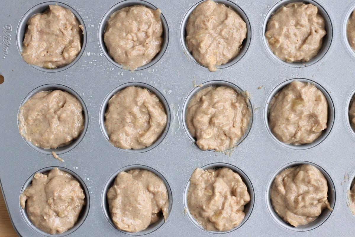 Banana muffin batter in a mini muffin pan.