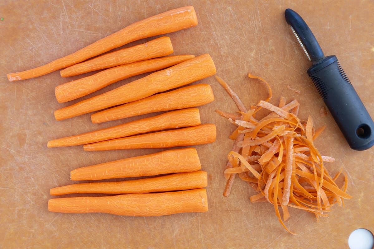 Peeled carrots with a vegetable peeler.