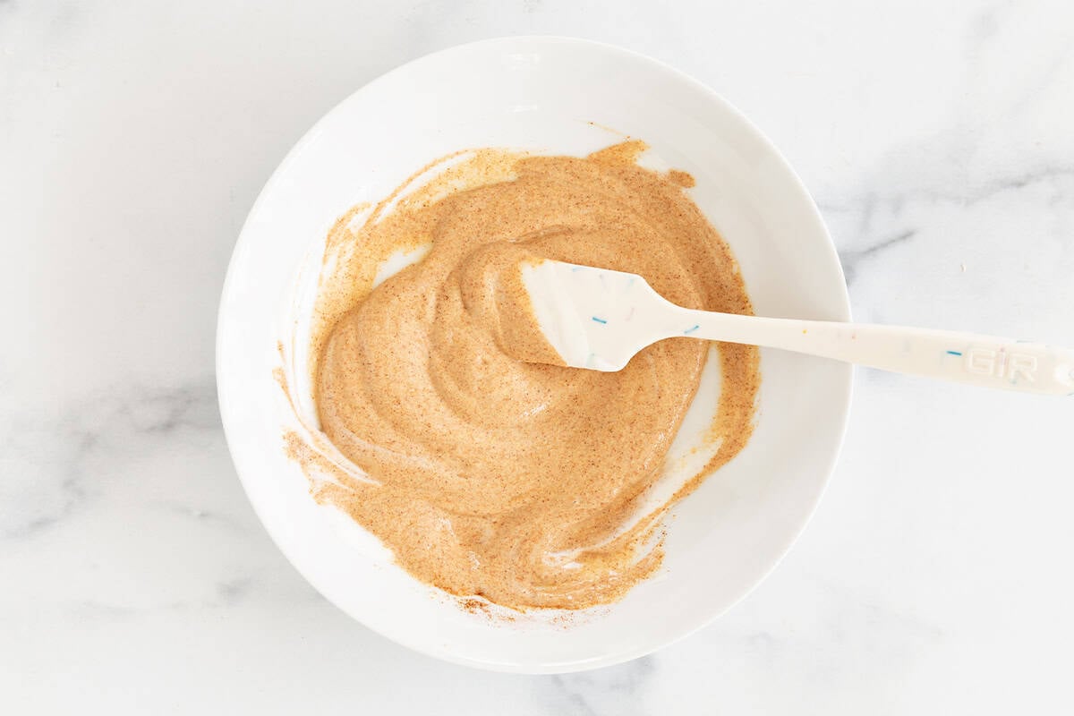 Spiced yogurt marinade in a bowl.