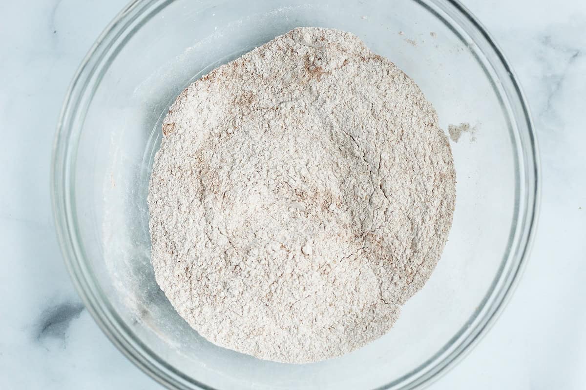 Dry pancake ingredients mixed in a glass bowl.