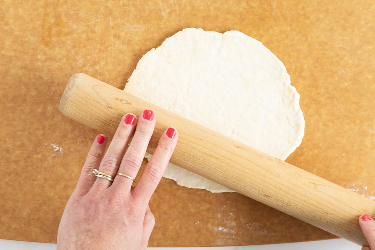 Greek yogurt pizza dough being rolled out.