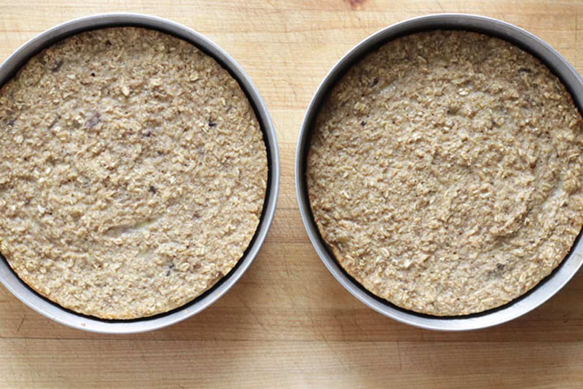 Two baked banana cakes in round pans.