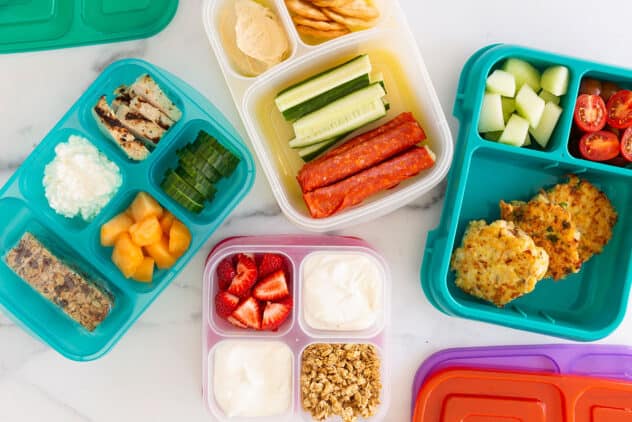 four lunch boxes on counter.