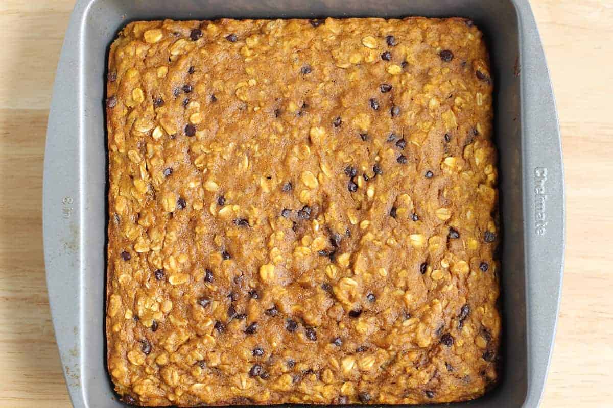 Baked pumpkin bars in a square baking pan.