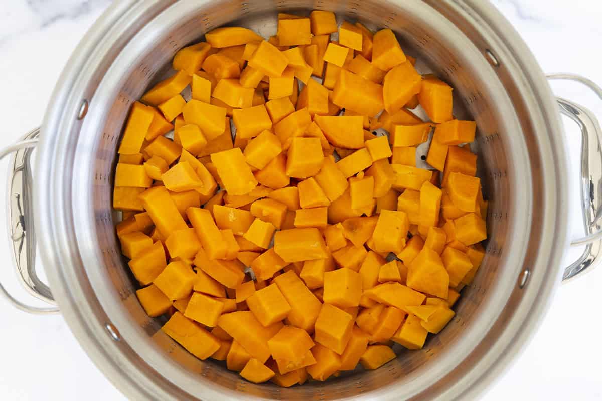 Cooked sweet potatoes in a food processor.
